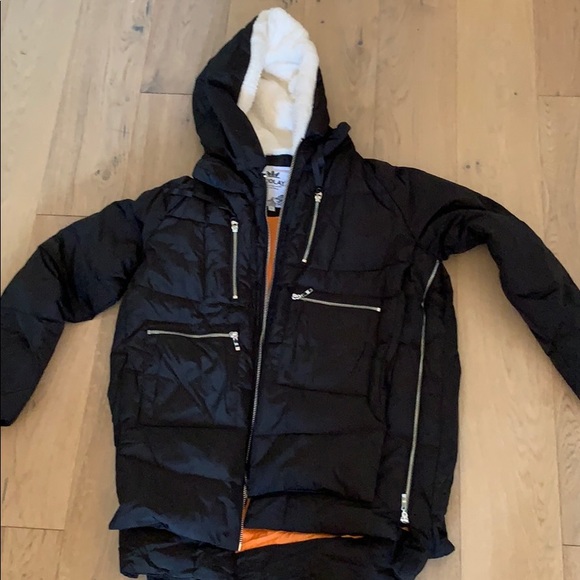 black puffer jacket with orange lining
